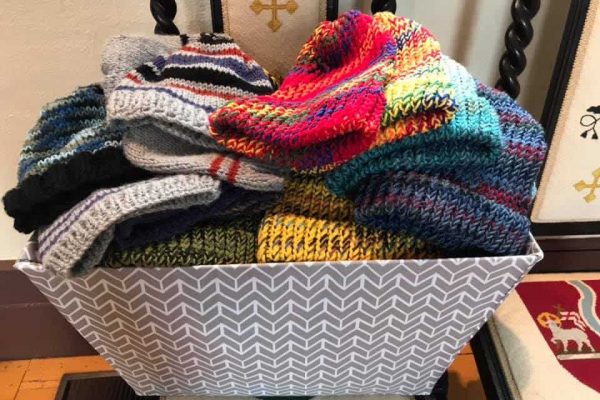knitting basket of knitted hats